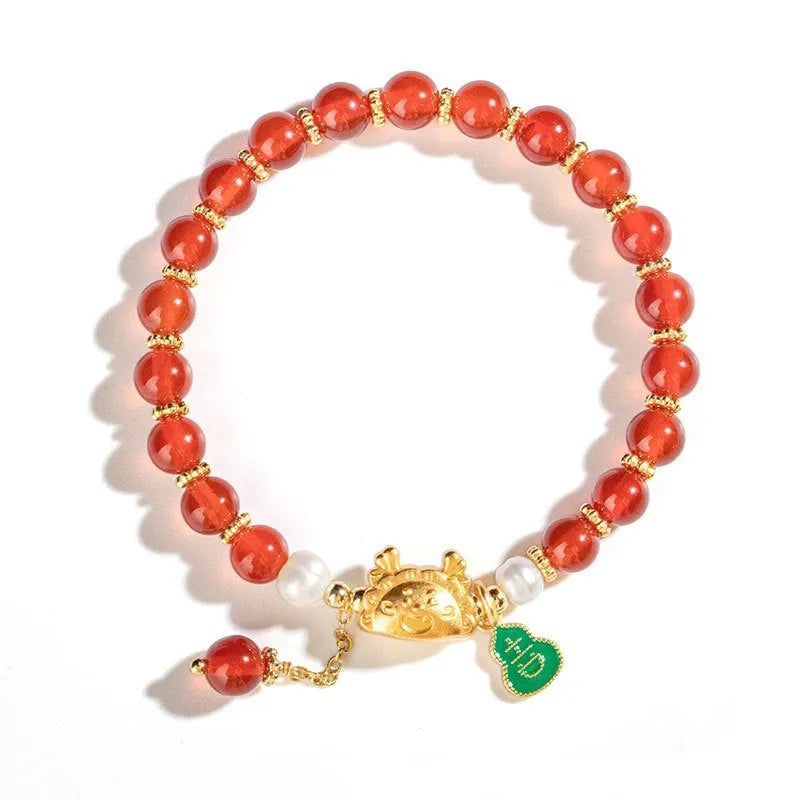 Close-up of an 8mm diamond-shaped bead bracelet in red agate, showing its unisex design.