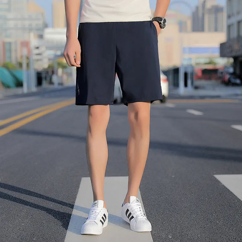 Men's quick-dry cotton five-point sports shorts in grey, black, and blue with elastic waist and drawstring, sizes L to 10XL