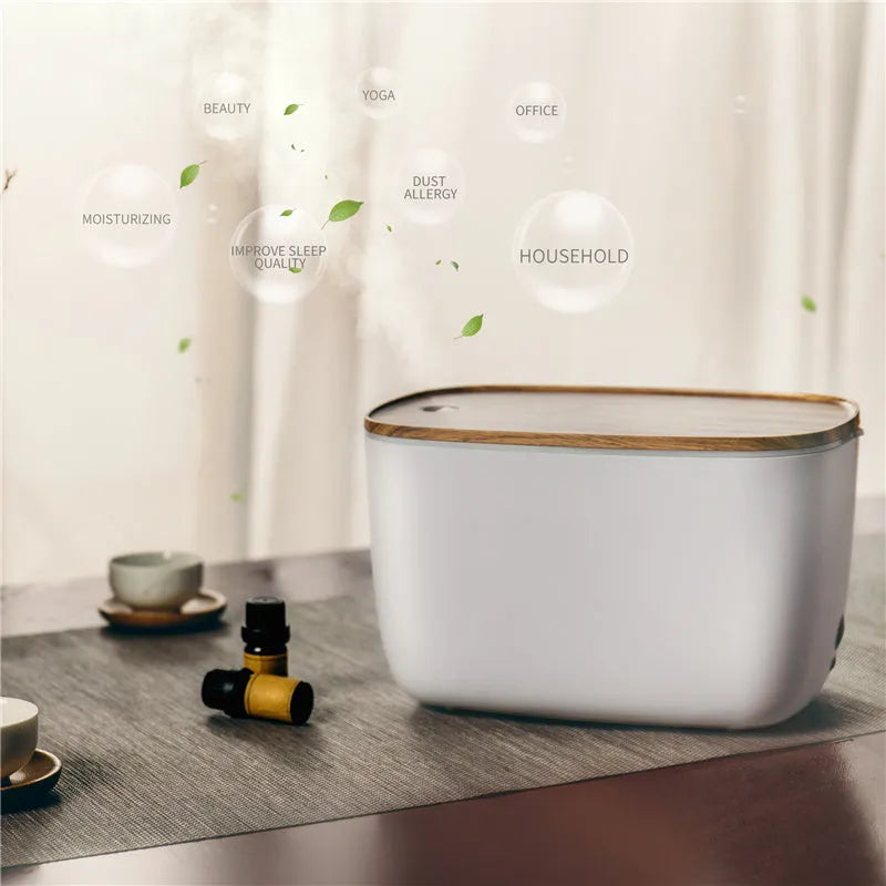 GX-22K compact white household humidifier and aromatherapy diffuser with night light on a wooden surface