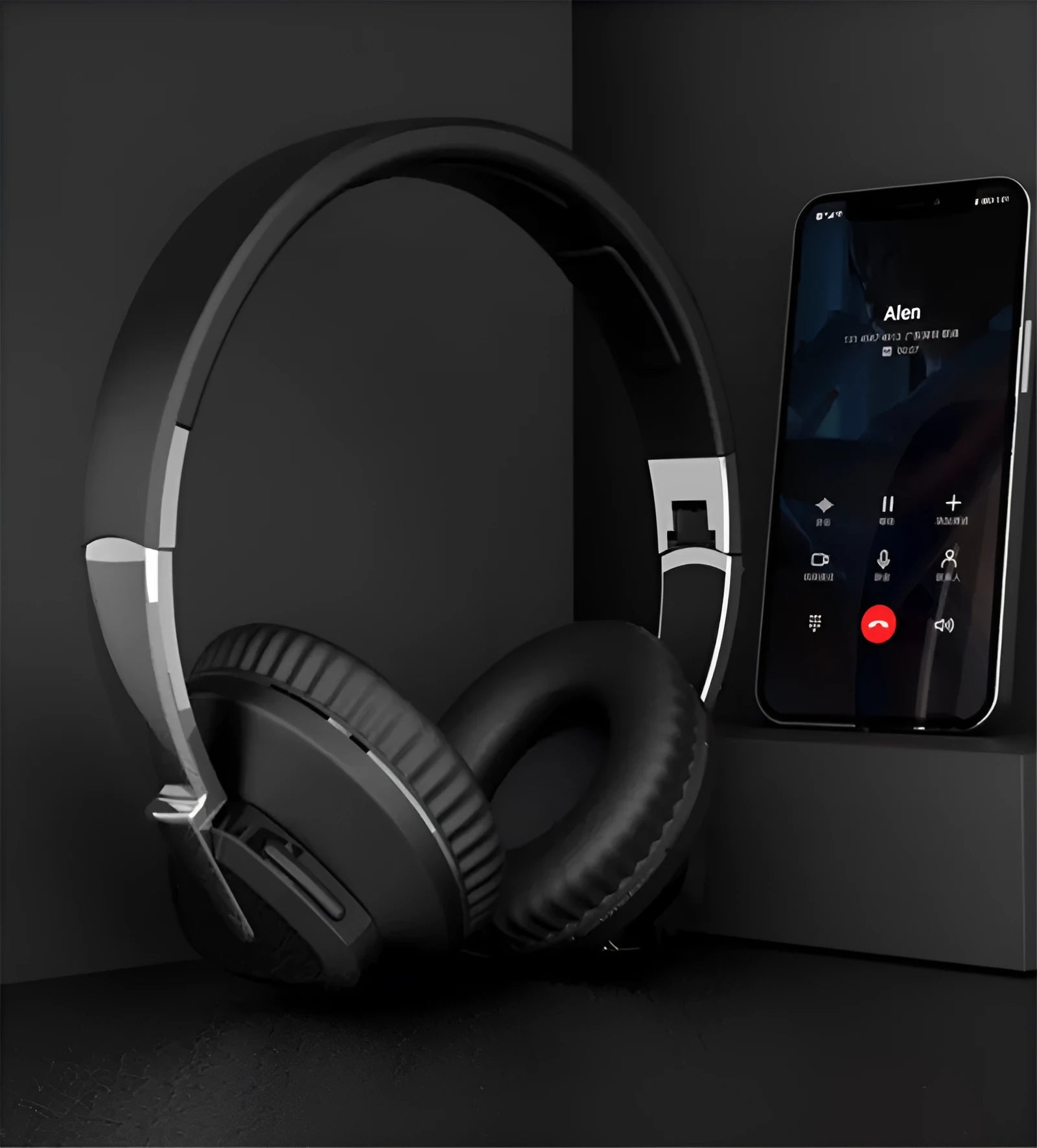 Black wireless over-ear Bluetooth headset with all-inclusive ear cups, showing AUX port and control buttons.