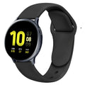 Samsung Galaxy Active 2 watch with a purple reverse buckle silicone strap on a wrist.