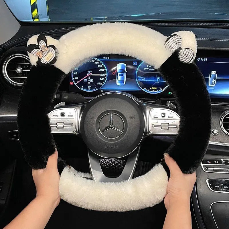 Milk tea white plush steering wheel cover with cute panda ears design on a car steering wheel