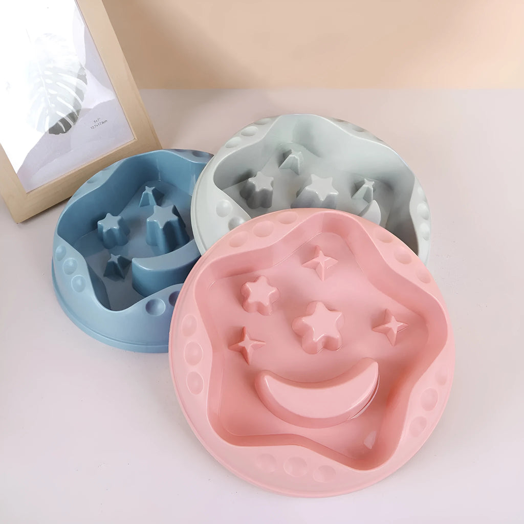 Moon star wings design slow feeder dog bowl in blue with non-slip base and internal ridges.
