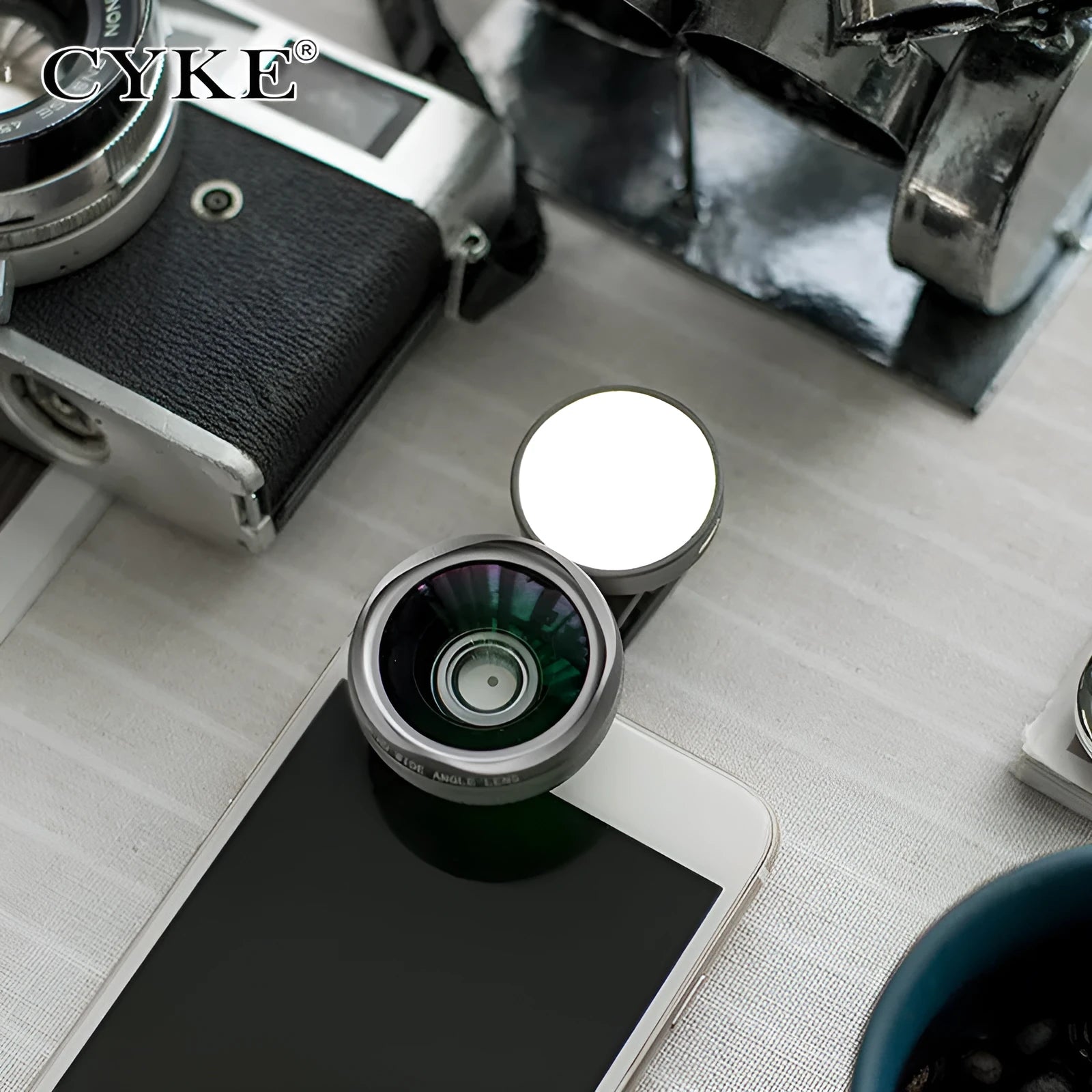 External wide-angle mobile phone camera lens with colourful LED lights in black, red, and silver grey