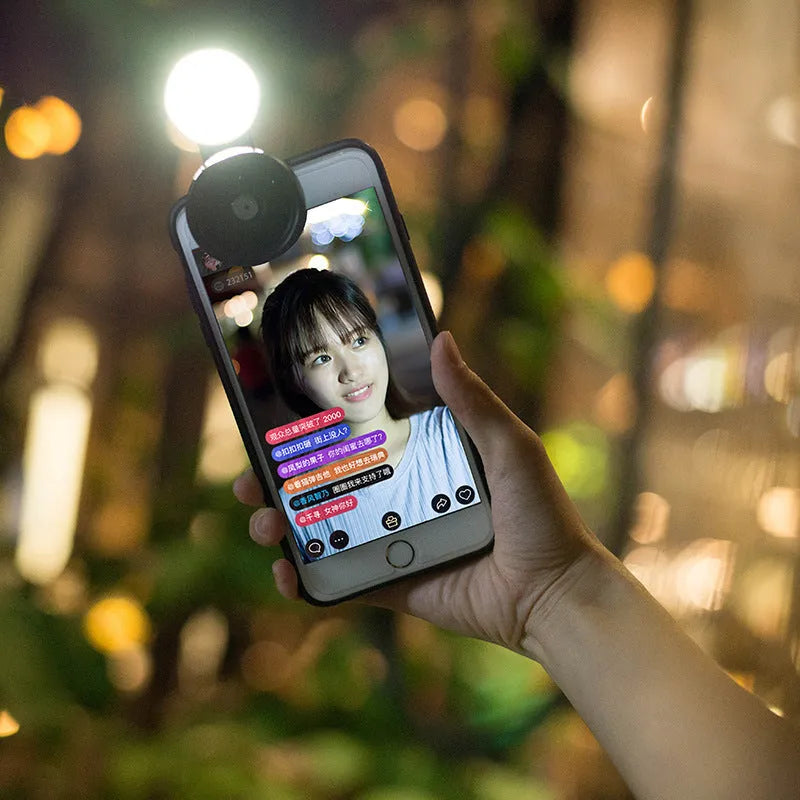 External wide-angle mobile phone camera lens with colourful LED lights in black, red, and silver grey