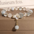 Woven aquamarine crystal bracelet with opal floral elements and cat motifs