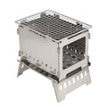 Silver outdoor folding card stove with grill mesh and storage bag on table