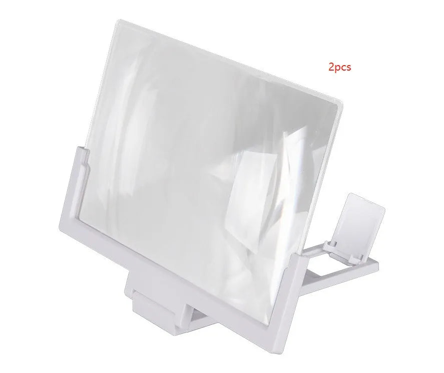 A black magnifying mobile phone stand holding a smartphone, showing the enlarged screen through the acrylic lens.