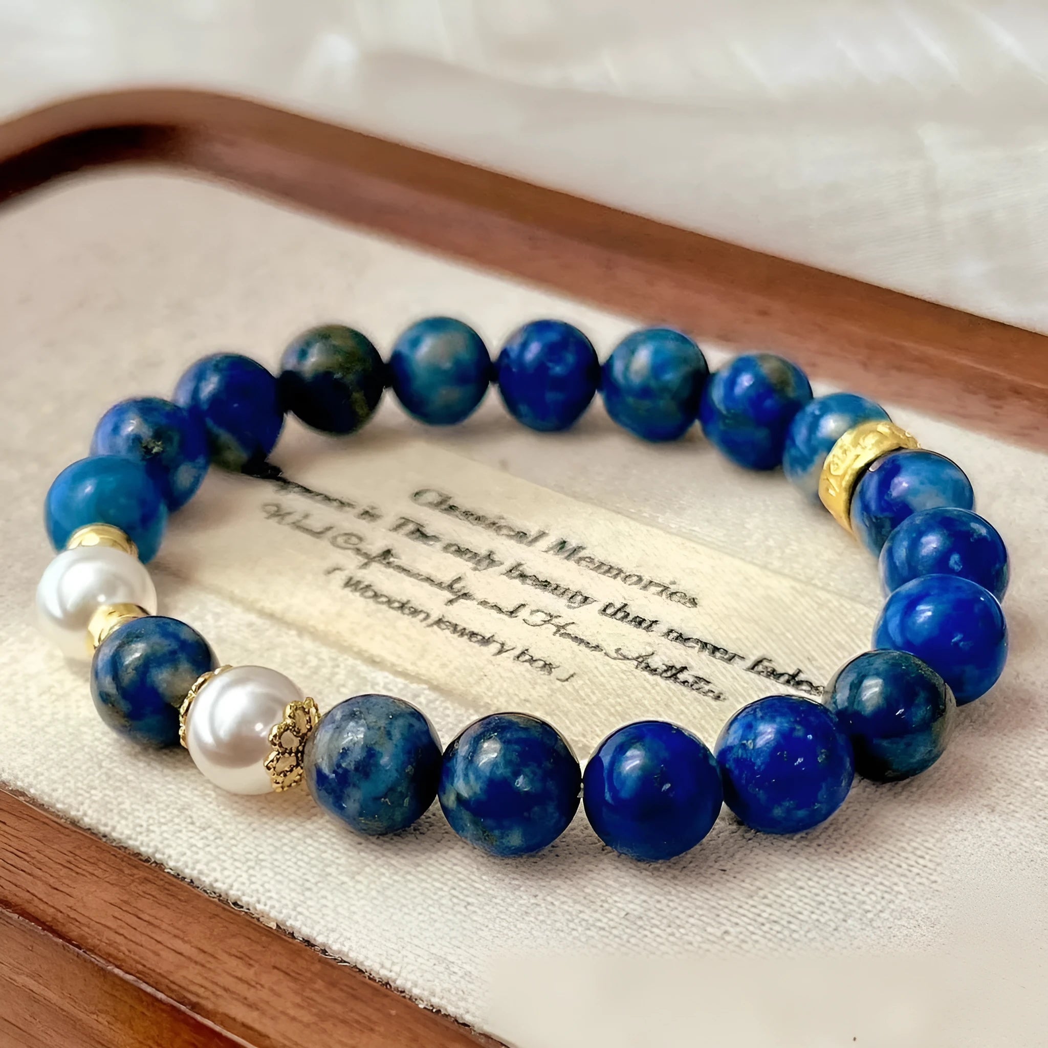 A lapis lazuli gemstone bracelet with a green and gold stone aesthetic in a Chinese artistic retro style.