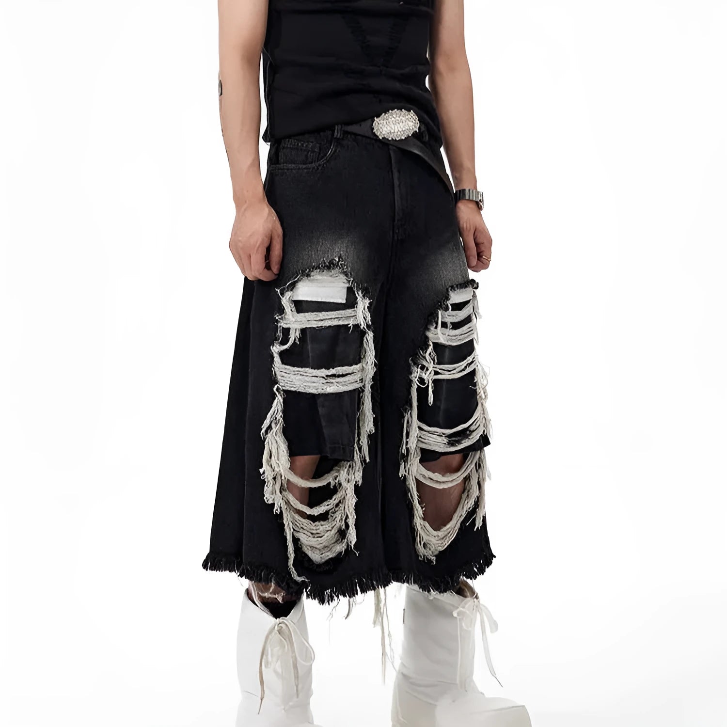 Black wide leg cropped jeans with distressed patch details on the legs, showing a mid-high waist.