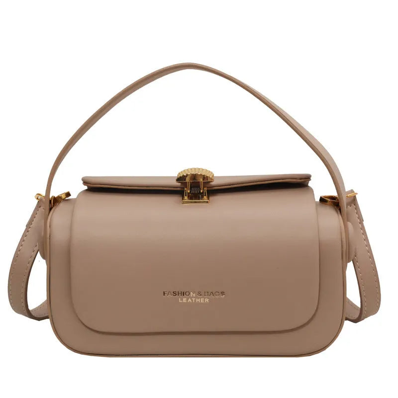 Personalised women's messenger shoulder bag with a letter detail in PU leather, shown in beige colour.