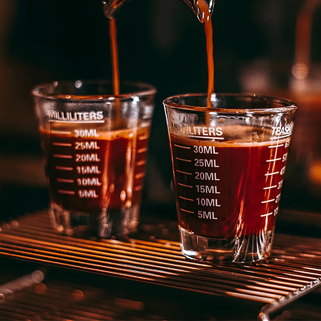 Mini retro glass measuring cup with scale showing 30ml capacity in solid colour