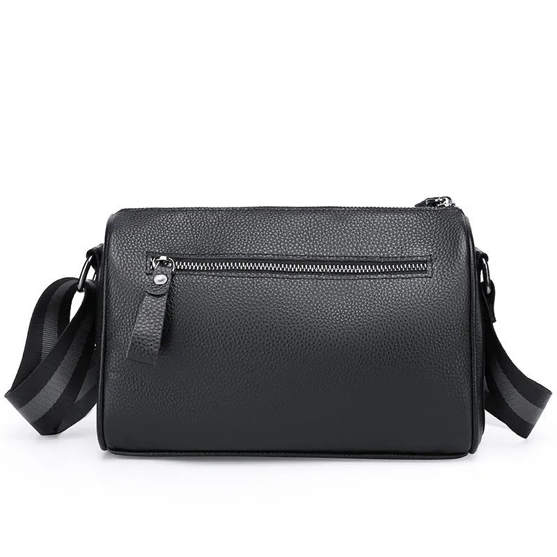 Black genuine leather one-shoulder crossbody bag showing dimensions and interior polyester lining