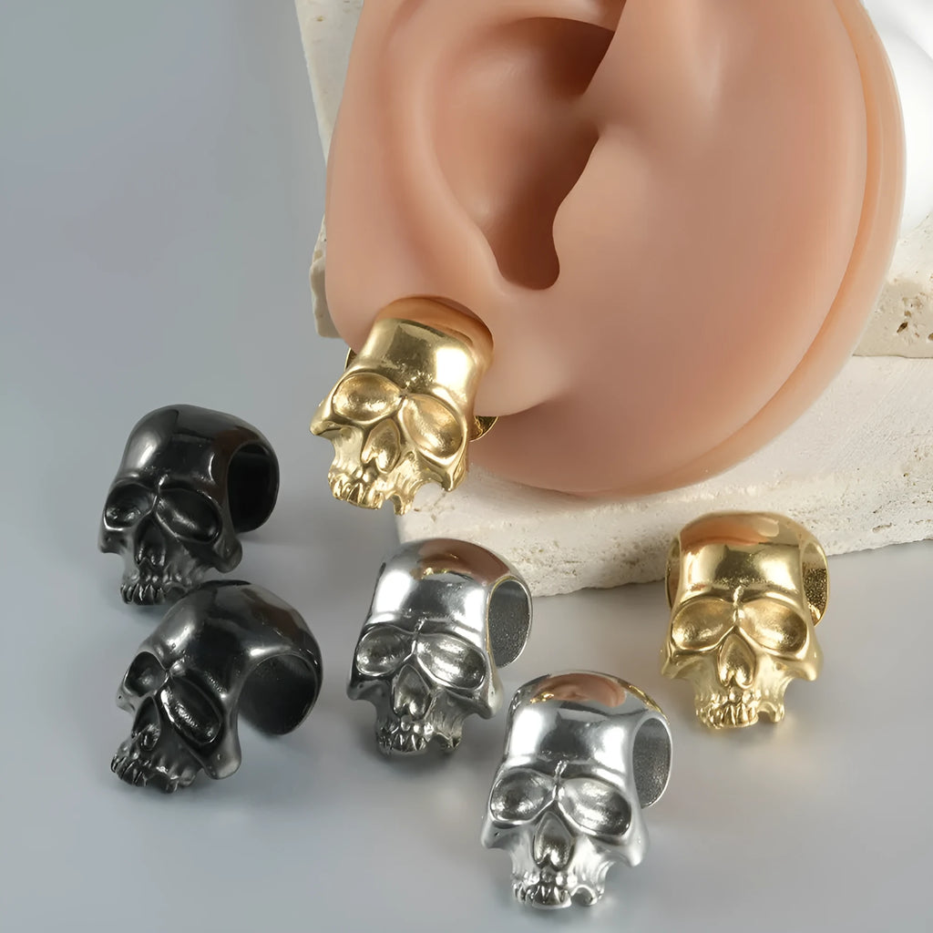 Stainless steel hollow skull Buddha earring in geometric hip hop style.