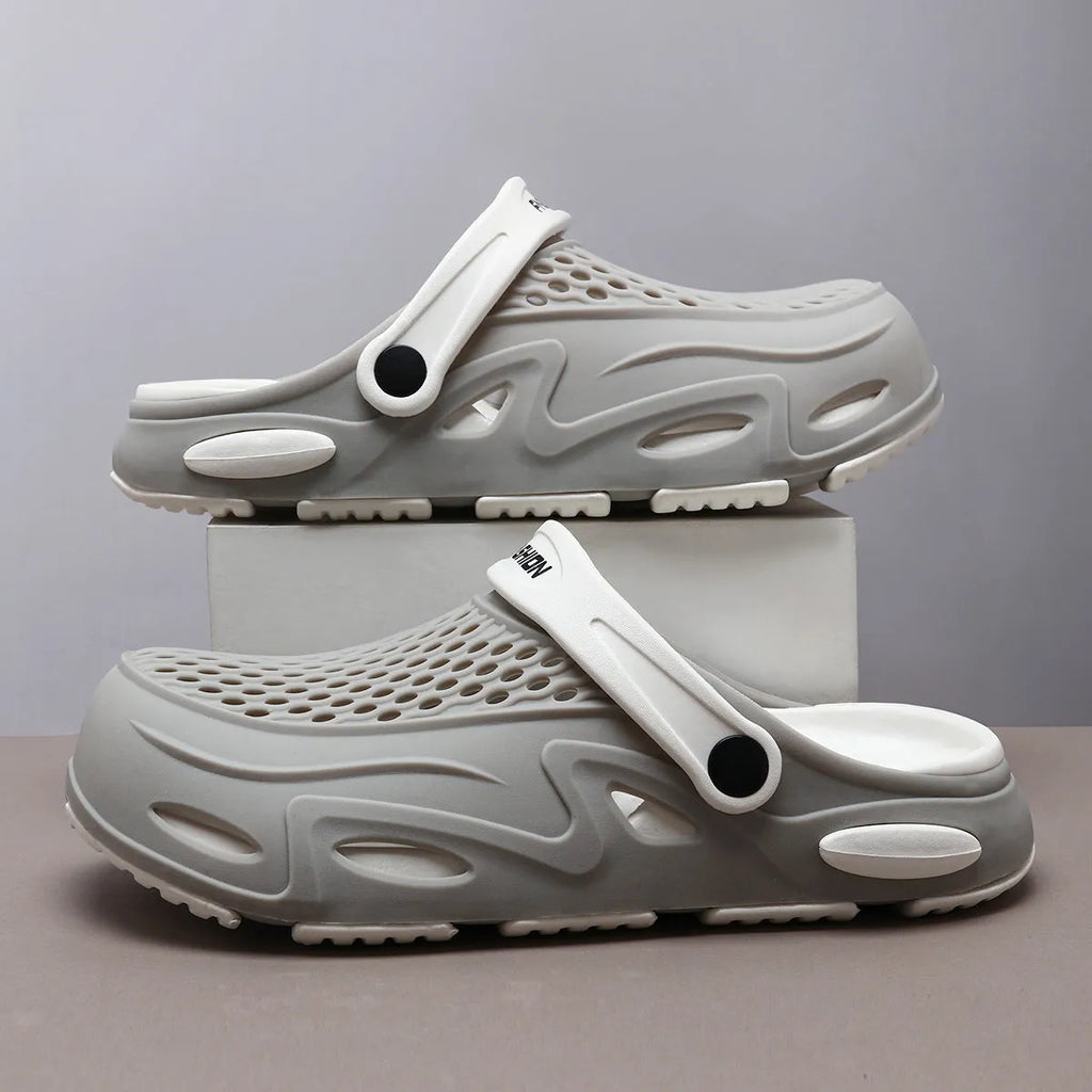 Men's closed toe beach slippers in gray colour showing grid pattern EVA construction with round toe design