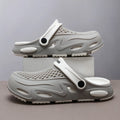 Men's closed toe beach slippers in gray colour showing grid pattern EVA construction with round toe design