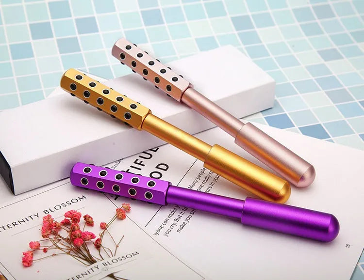 Germanium particles facial massage roller with 24 balls, purple body measuring 193mm
