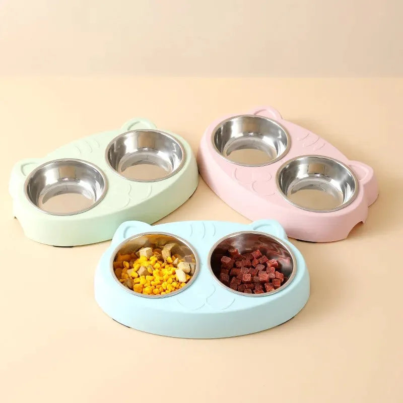 Blue plastic double-bowl pet food and water feeder tray with non-skid base.