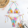 Women's triangle bikini swimming suit with floral gradient pattern and smocking craft detailing