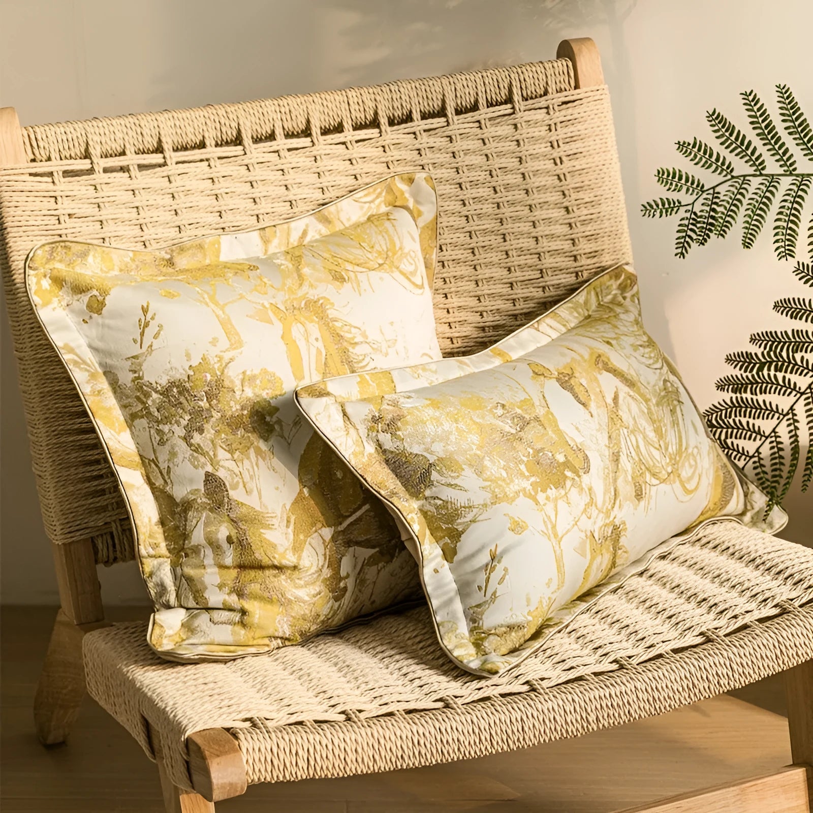Abstract golden horse design decorative jacquard cushion on a grey sofa.