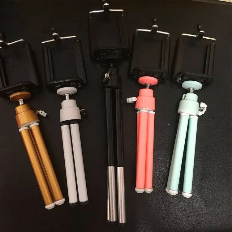 Black desktop mobile phone holder with adjustable two-section bracket for hands-free viewing.