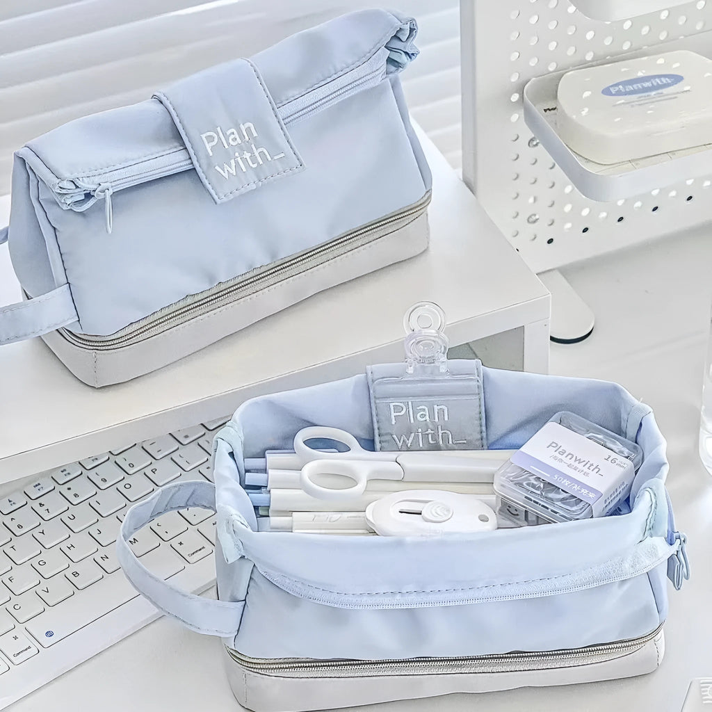 Polyester fabric pencil case with double layer folding design in dark blue, blue, and cream white colour options.