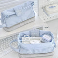 Polyester fabric pencil case with double layer folding design in dark blue, blue, and cream white colour options.