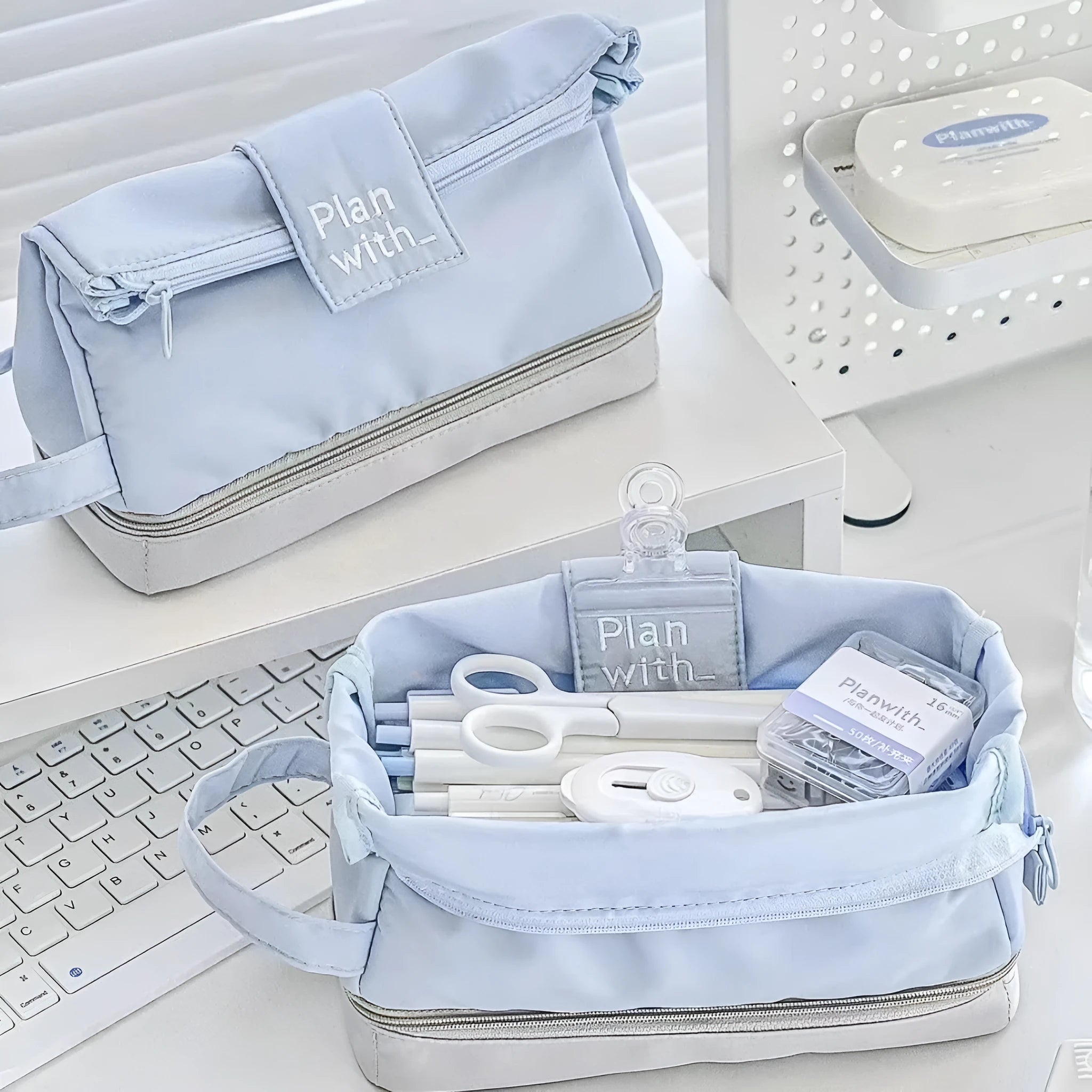 Polyester fabric pencil case with double layer folding design in dark blue, blue, and cream white colour options.