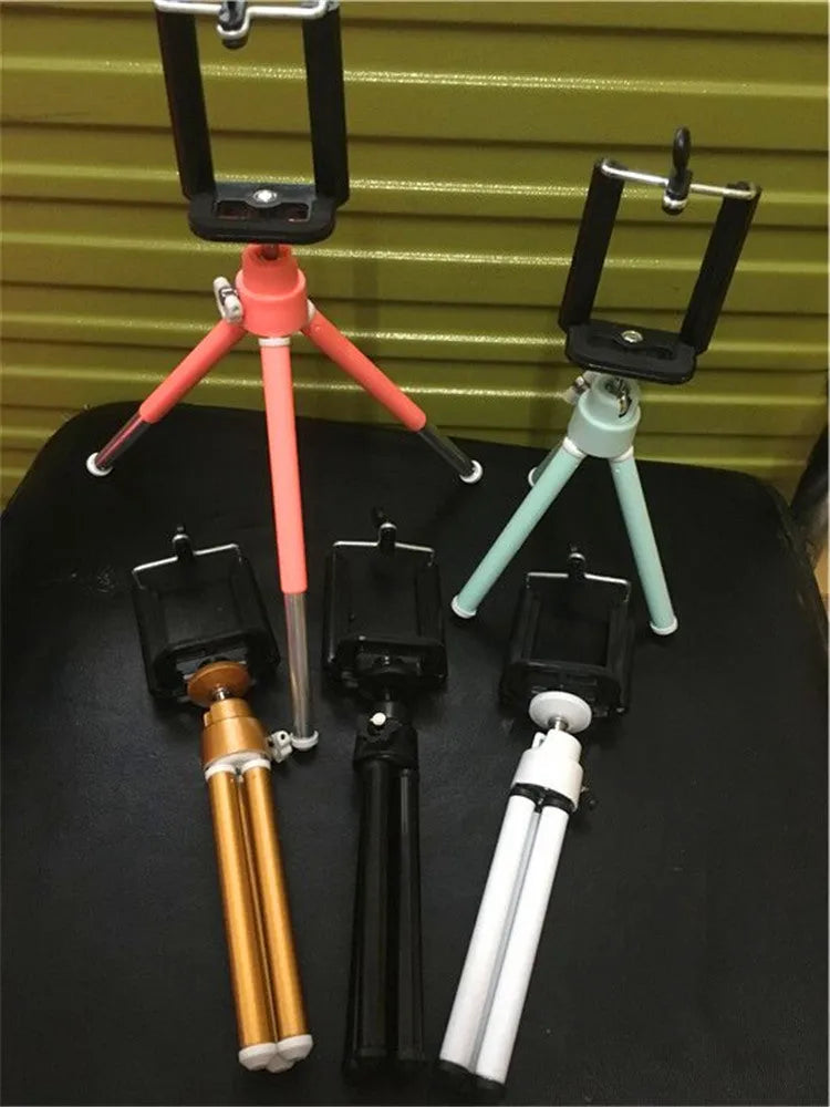 Black desktop mobile phone holder with adjustable two-section bracket for hands-free viewing.