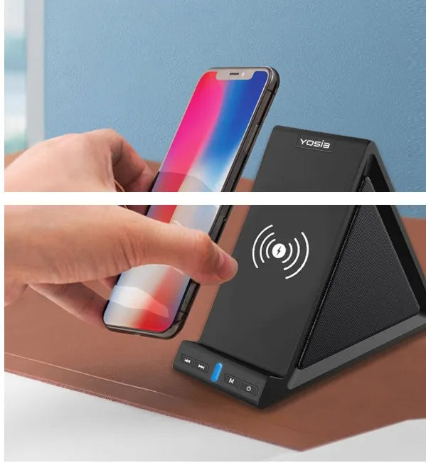 Matte black Bluetooth speaker with integrated phone stand and wireless charging pad on top.