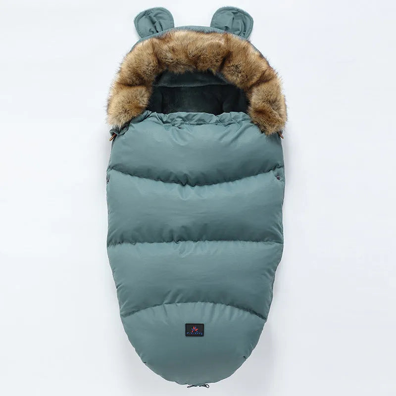 Baby warm cocoon style sleeping bag on a neutral background demonstrating solid colour design with zip closure