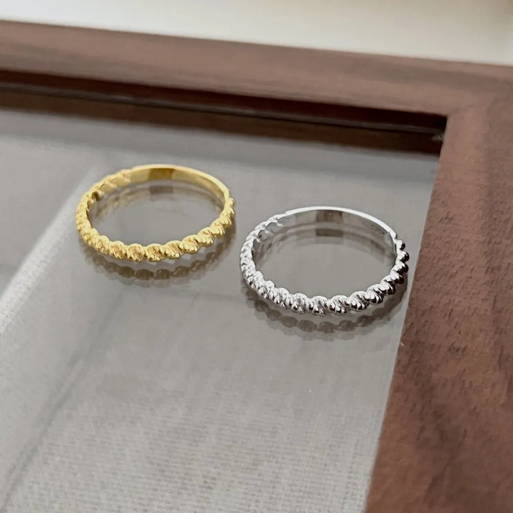 S925 sterling silver ring with geometric twist design in white gold colour finish