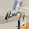 Flexible mount holder with suction base holding tablet at adjustable angle