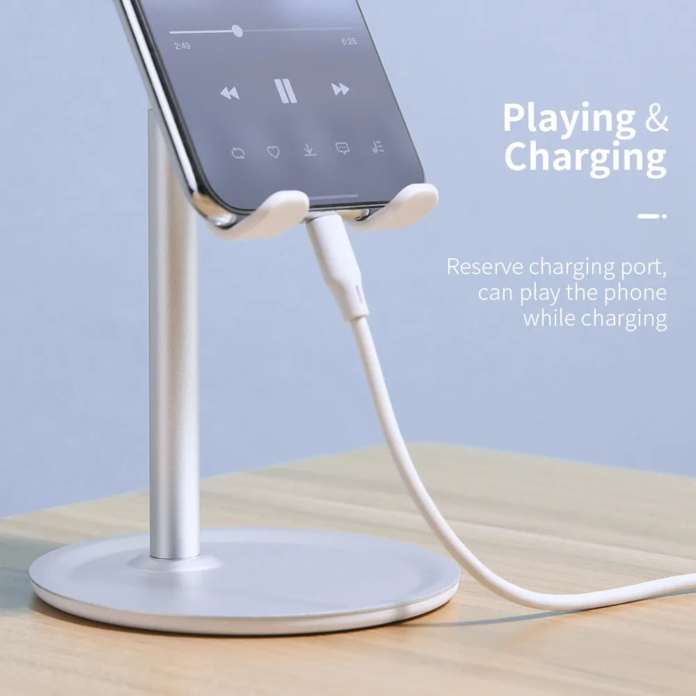 Silver white aluminium alloy desktop stand holding a mobile phone.