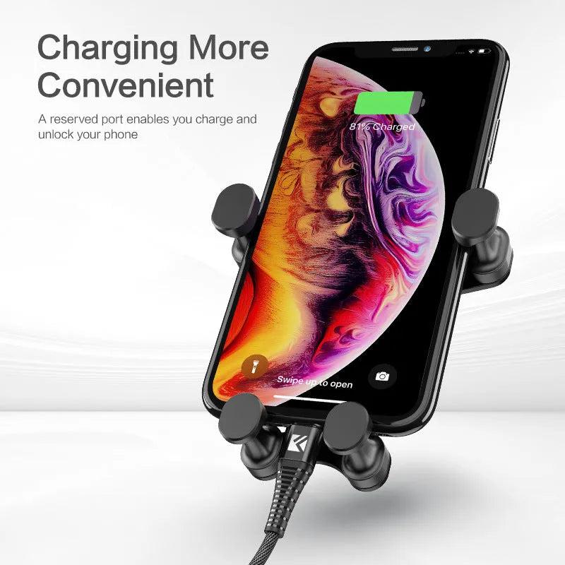 Black car mobile phone holder with gravity bracket mounted in vehicle air vent showing 360-degree rotation