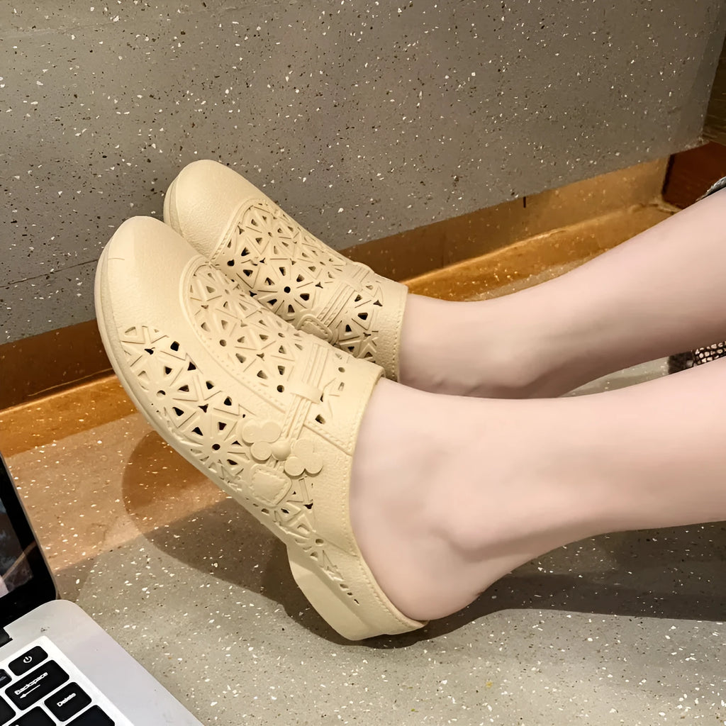 PVC flat toe box half slippers with hollow-out fairy style design in apricot colour.
