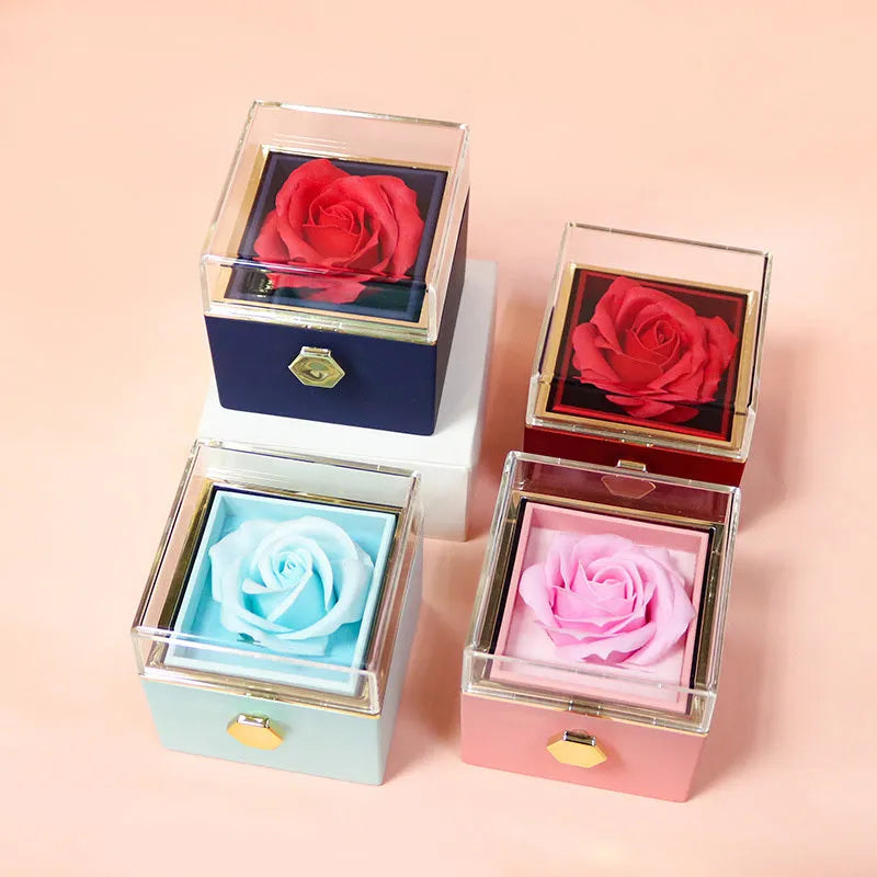 Rotating drawer jewellery gift box with red preserved rose under clear acrylic dome, showing open compartment.