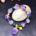 Purple natural shaped amethyst bead bracelet for women with a silver fu character charm.
