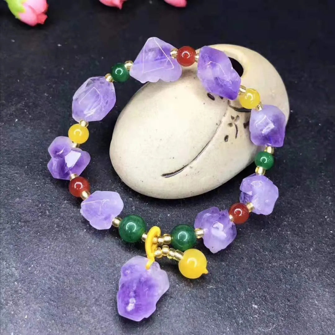 Purple natural shaped amethyst bead bracelet for women with a silver fu character charm.