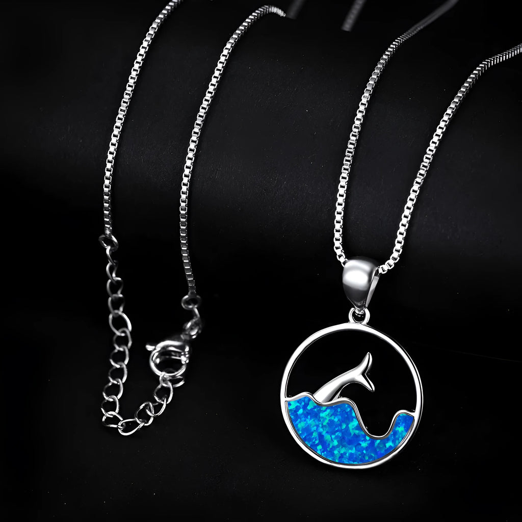 White gold electroplated copper necklace with a geometric blue opal fishtail pendant.