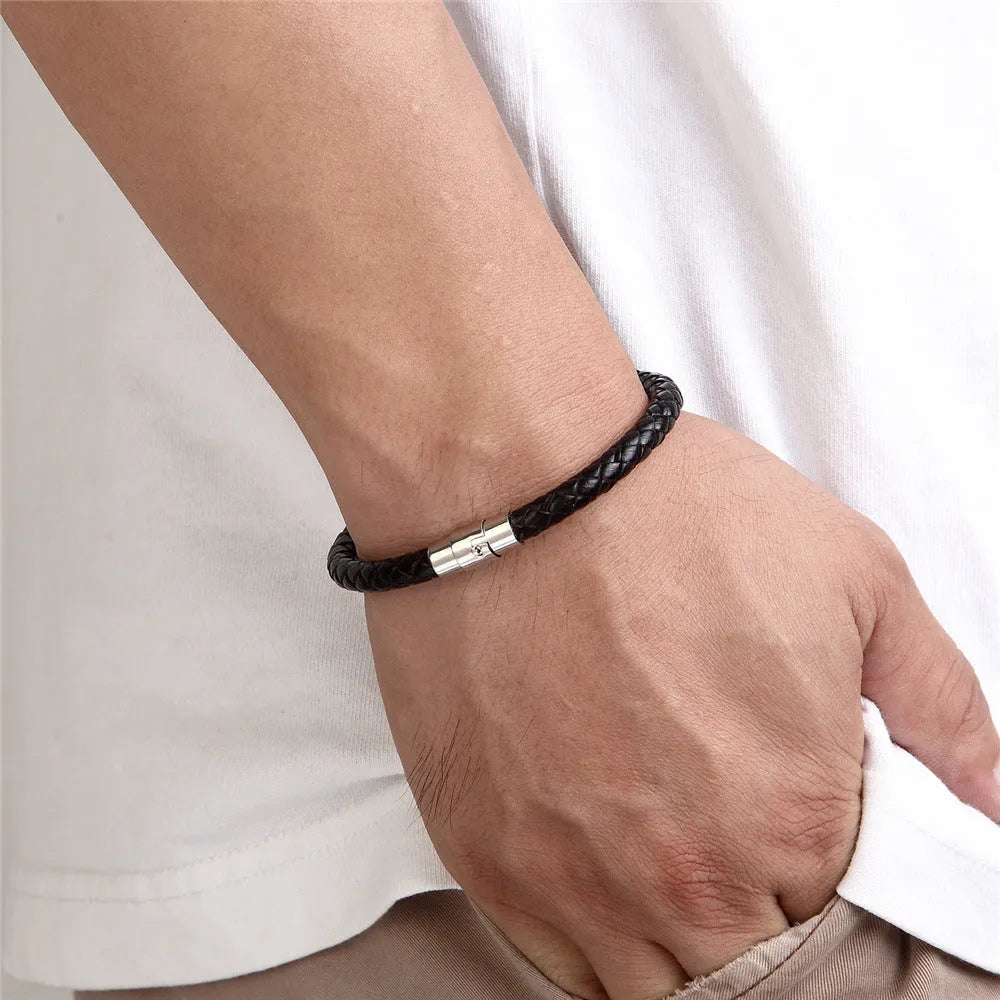 Geometric titanium steel wire bracelet with a magnetic clasp on a wrist, shown in a silver-toned finish.