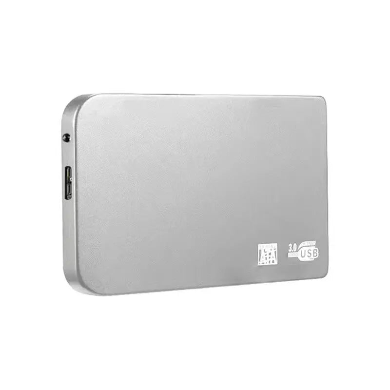 Silver USB 3.0 portable solid state drive with metal casing next to its included data cable.