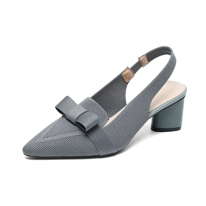 Women's closed toe high heel sandal with back ankle strap in a solid colour, showing pointed toe and fabric upper.