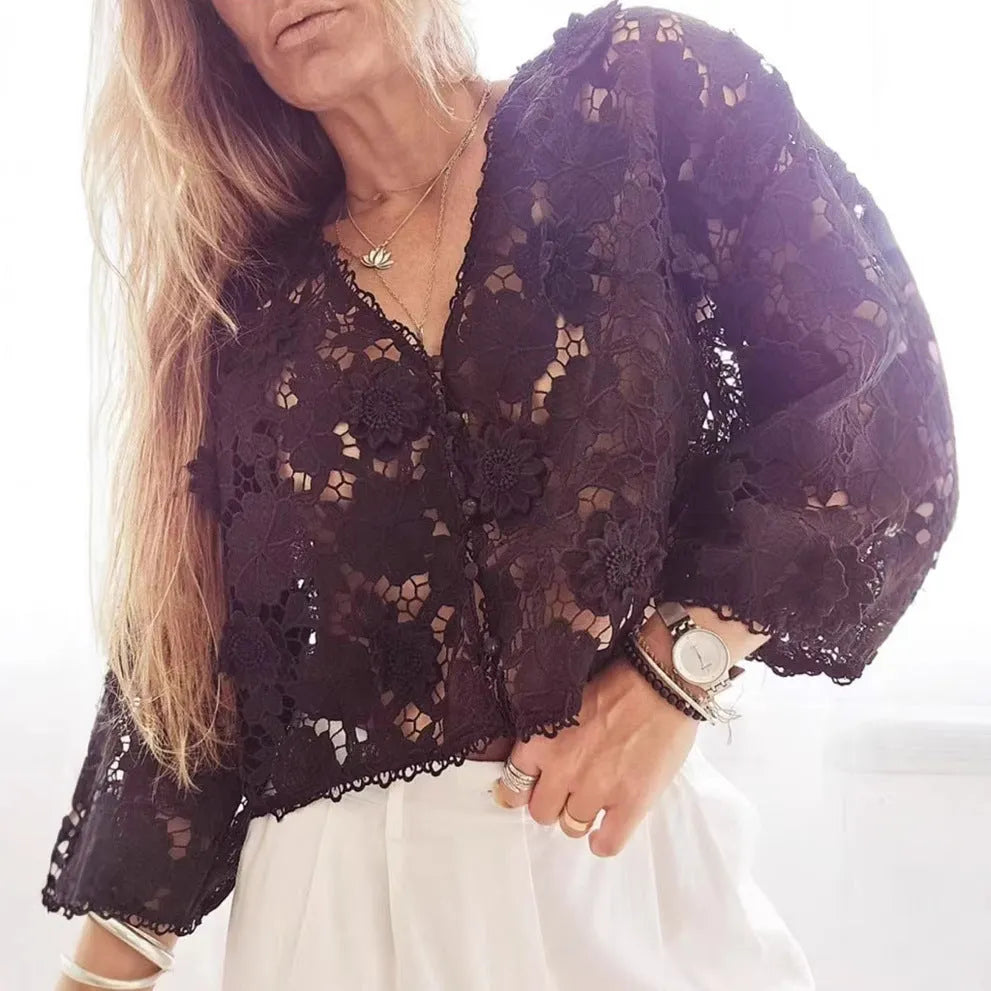 Black loose fit cardigan with white 3D lace floral decoration and a V-neckline