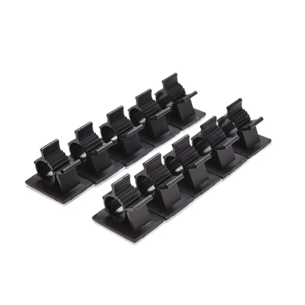 Ten black nylon adhesive cable clamps for wire management, shown with a cable inserted.