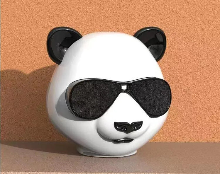 Portable mini Bluetooth speaker in a classic style design showing front grille.