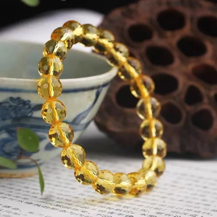 Handmade unisex bracelet with 128-faceted crystal beads and a decorative charm, available in multiple bead sizes.