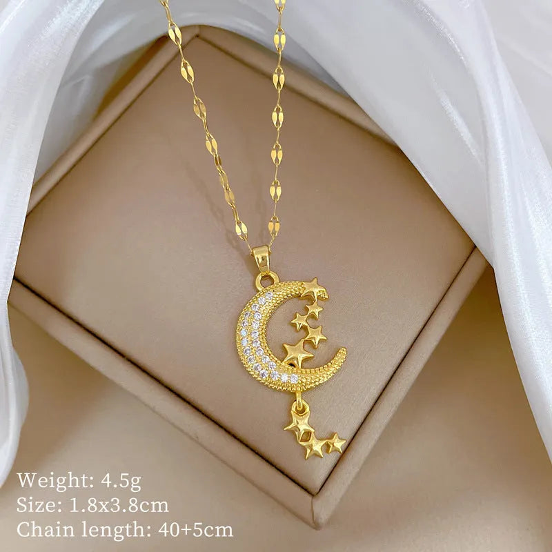 Geometric full moon pendant necklace with crystal setting and tassel on a stainless steel chain.