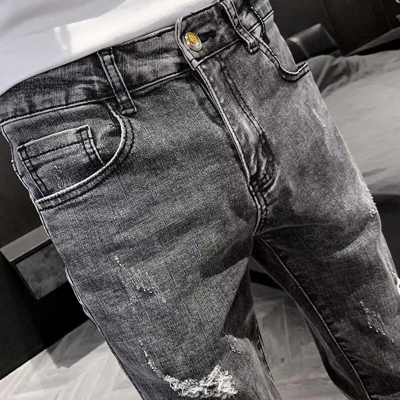 Men's classic high waist blue denim jeans with a button fly, shown laid flat.