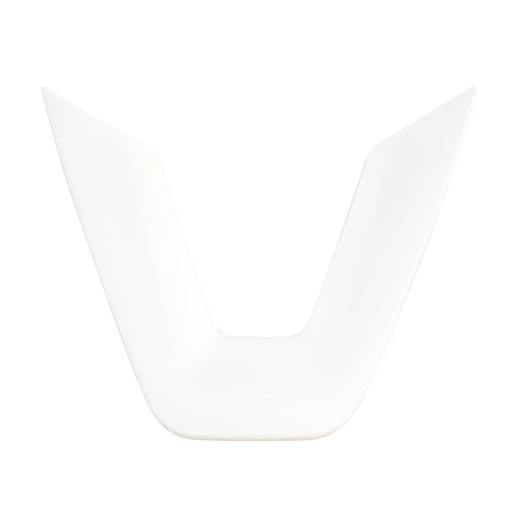 White plastic steering wheel protective patch on a car steering wheel.